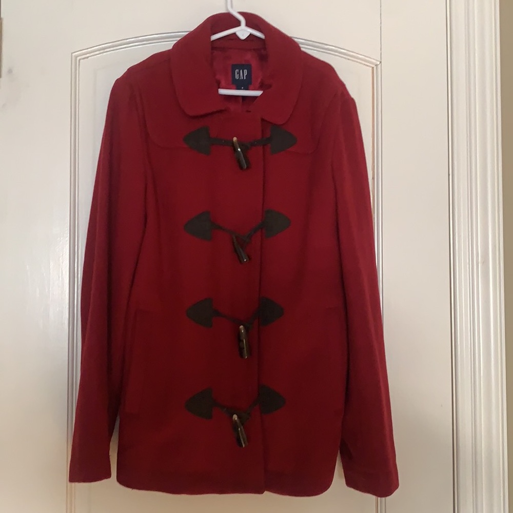 🛍 Classic red wool pea coat with toggle closures and zipper closures.